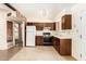 Cozy kitchen features wooden cabinetry, white appliances, and natural lighting at 4343 E Union Hills Dr, Phoenix, AZ 85050