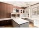Bright office space featuring custom built-ins, countertops, and natural light at 4343 E Union Hills Dr, Phoenix, AZ 85050