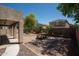 Beautifully landscaped backyard with a charming fountain, stone pathways, and lush greenery, perfect for outdoor relaxation at 4349 E Windsor Ct, Gilbert, AZ 85296
