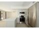 Bright kitchen with stainless steel appliances, white counters, and light wood floors at 4349 E Windsor Ct, Gilbert, AZ 85296