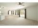 Bright living room with ceiling fan and access to back yard at 4349 E Windsor Ct, Gilbert, AZ 85296