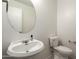 Bright powder room with a modern vanity and a round mirror, offering a fresh and clean space at 4349 E Windsor Ct, Gilbert, AZ 85296