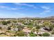 Beautiful aerial view of a residential area featuring lush trees, well-kept homes, and scenic mountain views at 4645 E Cambridge Ave, Phoenix, AZ 85008