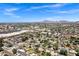 Scenic aerial view of the community featuring residential homes, mature trees, and distant mountain views at 4645 E Cambridge Ave, Phoenix, AZ 85008