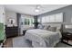 Serene bedroom with shutters, wood floors, a large dresser, and decoratively patterned curtains for a sophisticated look at 4645 E Cambridge Ave, Phoenix, AZ 85008
