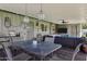Charming covered patio with a dining table, pendant lights, and a view of the backyard at 4645 E Cambridge Ave, Phoenix, AZ 85008