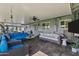 Inviting covered patio with stylish seating, a ceiling fan, and ample space for outdoor living and entertaining at 4645 E Cambridge Ave, Phoenix, AZ 85008