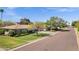 Charming single-story home with well-manicured lawn and lush landscaping along a quiet street at 4645 E Cambridge Ave, Phoenix, AZ 85008