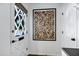 Bright entryway with a patterned glass door, white trim, and stylish decor at 4645 E Cambridge Ave, Phoenix, AZ 85008
