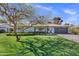 Charming single-story home with a manicured lawn and a welcoming front yard in a tranquil neighborhood at 4645 E Cambridge Ave, Phoenix, AZ 85008