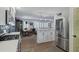 Open-concept kitchen featuring stainless appliances, white cabinetry, and a seamless layout at 4645 E Cambridge Ave, Phoenix, AZ 85008
