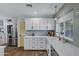 Contemporary kitchen with white cabinets, stainless steel appliances, and a bright, airy feel at 4645 E Cambridge Ave, Phoenix, AZ 85008