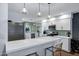 Bright kitchen features white cabinets, stainless steel appliances, and an attractive backsplash at 4645 E Cambridge Ave, Phoenix, AZ 85008