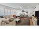 Spacious living room with a cozy sectional sofa, modern decor, and lots of natural light at 4645 E Cambridge Ave, Phoenix, AZ 85008