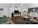 Inviting living room featuring an open floor plan, modern furnishings, and a view into the kitchen at 4645 E Cambridge Ave, Phoenix, AZ 85008