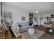 Open living room with hardwood floors, a comfortable sofa, a decorative rug, and a piano at 4645 E Cambridge Ave, Phoenix, AZ 85008