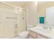Bathroom features a single vanity, white toilet, and shower behind glass at 4826 S 26Th Ln, Phoenix, AZ 85041