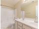 Bright bathroom featuring a double vanity and shower-tub combo at 4826 S 26Th Ln, Phoenix, AZ 85041