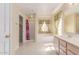 Bright bathroom featuring a soaking tub, separate shower, and vanity with wood cabinets at 4826 S 26Th Ln, Phoenix, AZ 85041