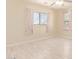 Bedroom with light floors and two windows overlooking the yard at 4826 S 26Th Ln, Phoenix, AZ 85041