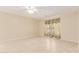 Bright, airy bedroom featuring neutral walls, a ceiling fan, and light wood-look floors at 4826 S 26Th Ln, Phoenix, AZ 85041