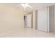 Bright bedroom features a closet, light walls, and tile floors at 4826 S 26Th Ln, Phoenix, AZ 85041