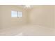 Bedroom with tile floors and a window overlooking an empty lot at 4826 S 26Th Ln, Phoenix, AZ 85041