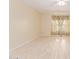 Spacious bedroom with neutral tones, bright natural light, and wood look flooring at 4826 S 26Th Ln, Phoenix, AZ 85041