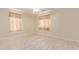 Bright bedroom features neutral walls, wood-look floors, and a ceiling fan at 4826 S 26Th Ln, Phoenix, AZ 85041