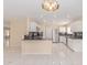 Spacious open kitchen with white cabinets, stainless steel appliances, and modern countertops at 4826 S 26Th Ln, Phoenix, AZ 85041