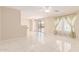 Open living space features a sliding glass door and tile floors at 4826 S 26Th Ln, Phoenix, AZ 85041