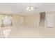 Open-concept living room features tile flooring and staircase to the second floor at 4826 S 26Th Ln, Phoenix, AZ 85041