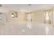 Spacious living area featuring tile floors and large windows at 4826 S 26Th Ln, Phoenix, AZ 85041