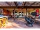 Covered back patio with a variety of unique outdoor furniture and a wooden pergola at 5616 E Desert Vista Trl, Cave Creek, AZ 85331