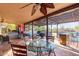 A covered back patio featuring a ceiling fan, outdoor seating and a bar at 5616 E Desert Vista Trl, Cave Creek, AZ 85331