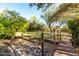 Backyard water feature with a bridge, decorative rocks and chain details at 5616 E Desert Vista Trl, Cave Creek, AZ 85331