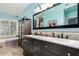 A bathroom featuring a double vanity, quartz counters, and large mirror at 5616 E Desert Vista Trl, Cave Creek, AZ 85331