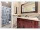 Bathroom with a marble vanity with sink, mirror, and a shower and toilet area at 5616 E Desert Vista Trl, Cave Creek, AZ 85331