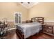 This bedroom features hardwood floors and a window with shutters for plenty of natural light at 5616 E Desert Vista Trl, Cave Creek, AZ 85331