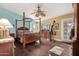 A primary bedroom with a ceiling fan, hardwood floors, and ample natural light at 5616 E Desert Vista Trl, Cave Creek, AZ 85331