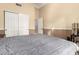 This bedroom features a closet with white doors and an adjoining bathroom at 5616 E Desert Vista Trl, Cave Creek, AZ 85331