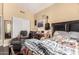 This bedroom features hardwood floors, a chair, and a closet with white doors at 5616 E Desert Vista Trl, Cave Creek, AZ 85331