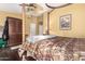 A primary bedroom with a ceiling fan, hardwood floors, and ample natural light at 5616 E Desert Vista Trl, Cave Creek, AZ 85331