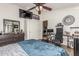 A bedroom with a ceiling fan, carpet floors, and ample natural light at 5616 E Desert Vista Trl, Cave Creek, AZ 85331