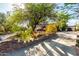Charming single-story home featuring desert landscaping, a large driveway, and stone accents at 5616 E Desert Vista Trl, Cave Creek, AZ 85331
