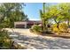 Charming single-story home featuring desert landscaping, a large driveway, and a two-car garage at 5616 E Desert Vista Trl, Cave Creek, AZ 85331