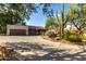 Charming single-story home featuring desert landscaping, a large driveway, and a two-car garage at 5616 E Desert Vista Trl, Cave Creek, AZ 85331