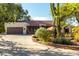 Charming single-story home featuring desert landscaping, a large driveway, and a two-car garage at 5616 E Desert Vista Trl, Cave Creek, AZ 85331
