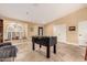 Spacious game room with tile floors, foosball table and natural light from the lovely arched window at 5616 E Desert Vista Trl, Cave Creek, AZ 85331
