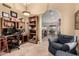Home office with an arched doorway and tiled floors and a desk with hutch bookcase at 5616 E Desert Vista Trl, Cave Creek, AZ 85331
